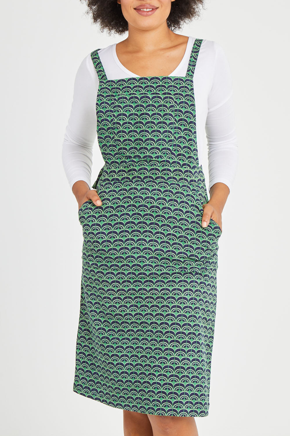 Model Olivia wearing size 10 of the Berty Reversible Tunic in colour Fresconavy (Blue), from the front, cropped image