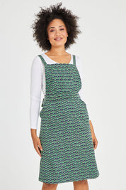 Model Olivia wearing size 10 of the Berty Reversible Tunic in colour Fresconavy (Blue), from the front, cropped image