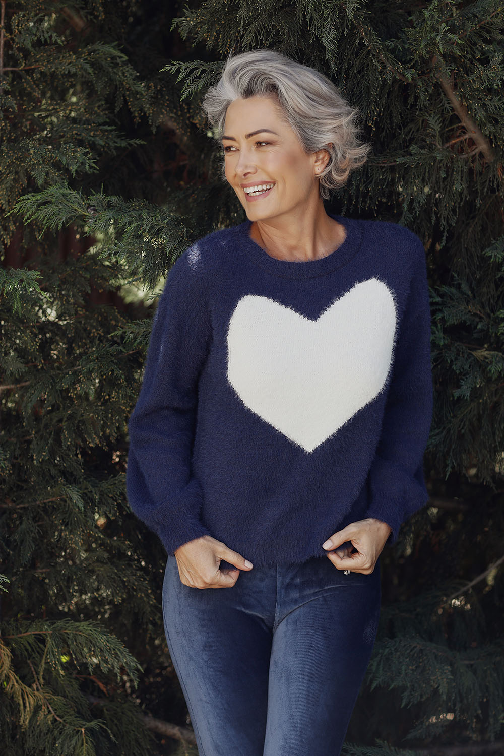 A model wearing the Heartscape Knit in colour Midnightb (Blue), from the front, showing the whole outfit