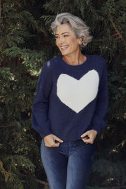 A model wearing the Heartscape Knit in colour Midnightb (Blue), from the front, showing the whole outfit