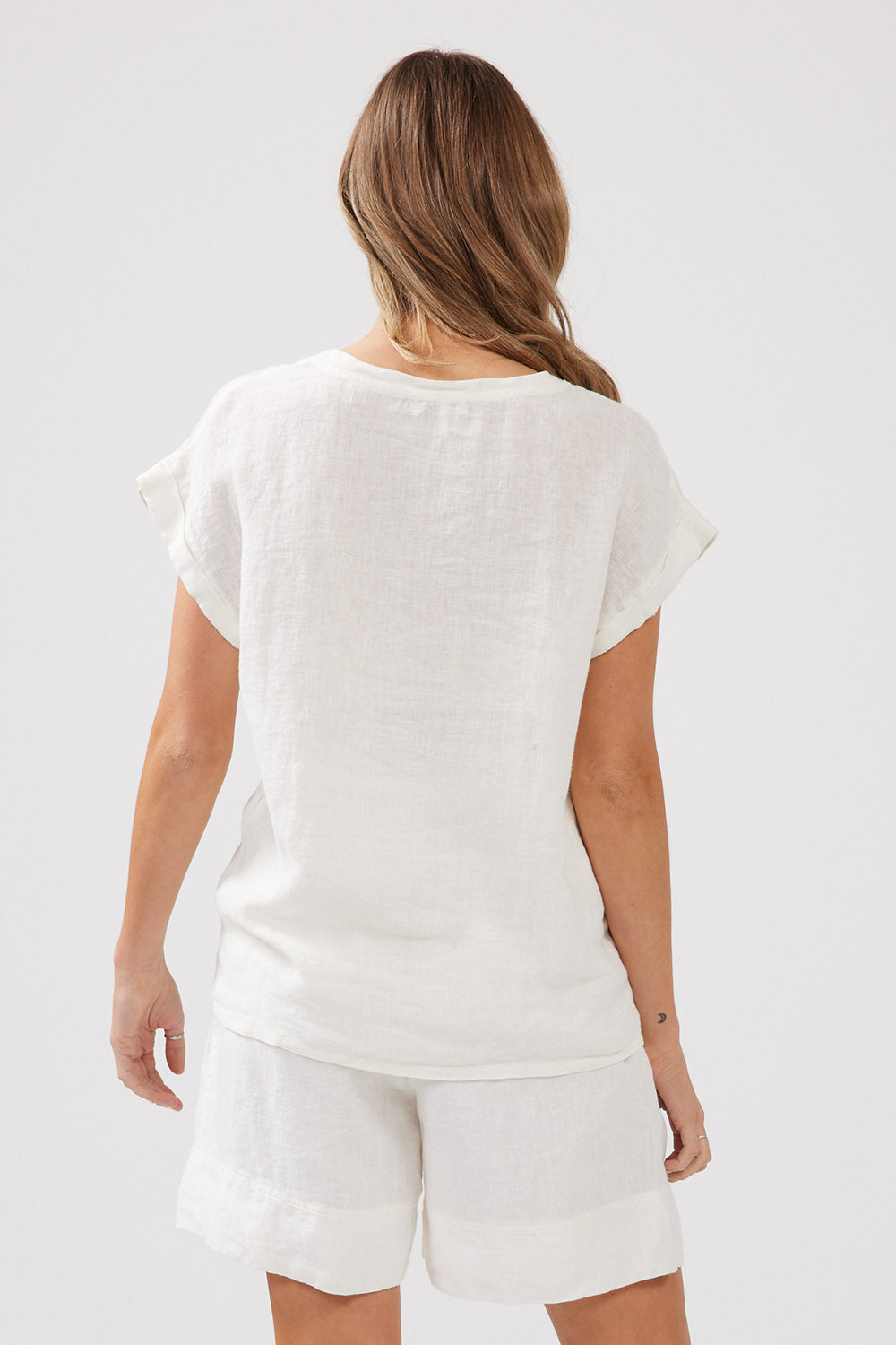 A model wearing the Percy Top in colour White (White), from the back