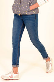 A model wearing the Preloved Skinny Jean in colour Blue (Blue), from the front, cropped image