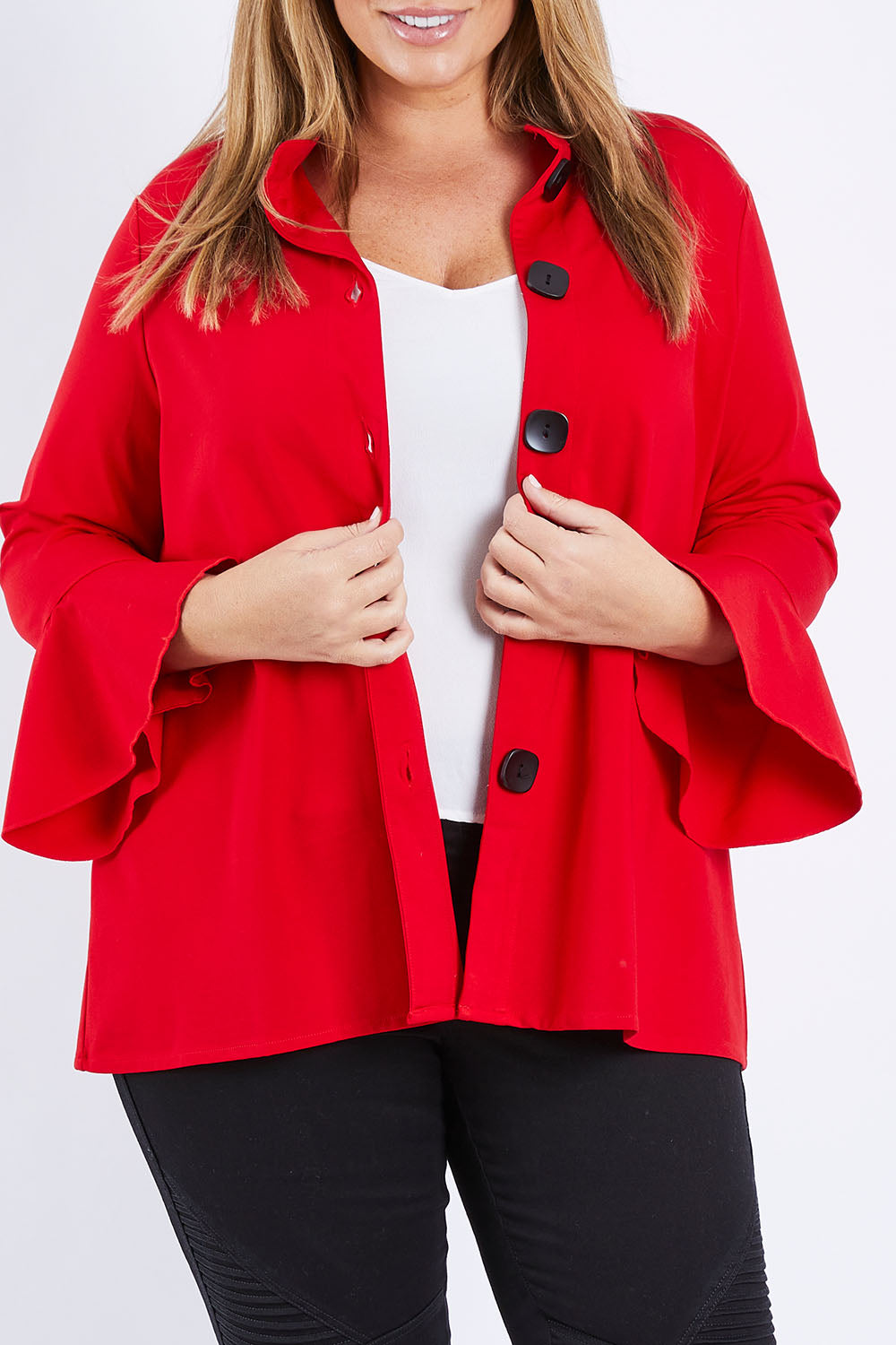 Model Fiona wearing size XL of the Crimson Button Jacket in colour Red (Red), from the front, cropped image