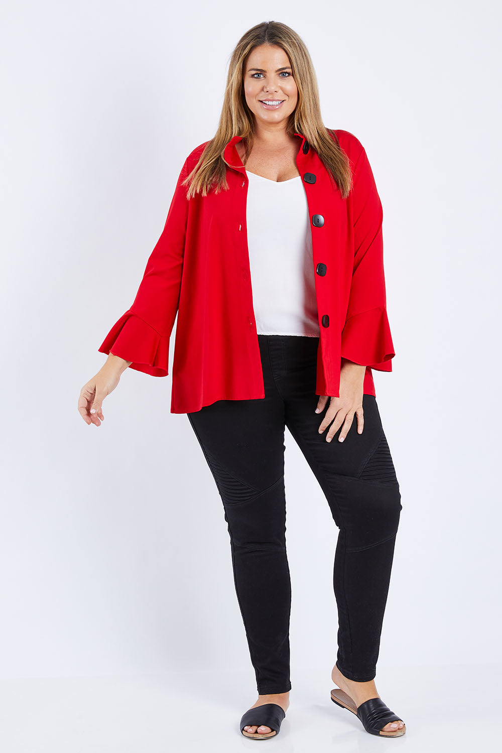 Model Fiona wearing size XL of the Crimson Button Jacket in colour Red (Red), from the front, showing the whole outfit