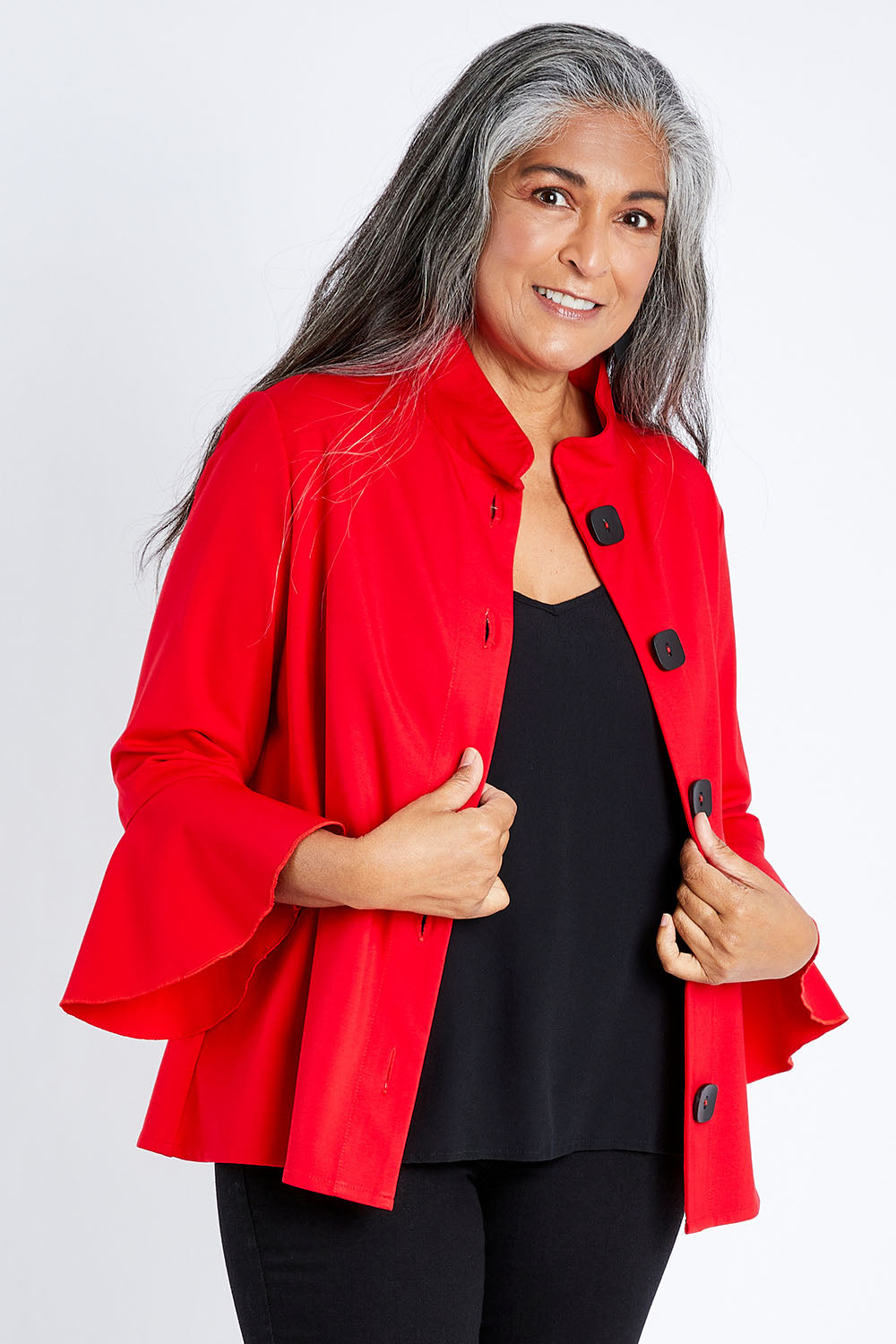 Model Nadine wearing size S of the Crimson Button Jacket in colour Red (Red), from the front, cropped image