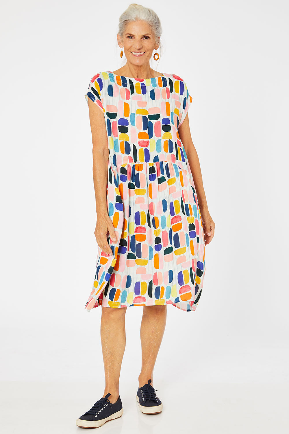 Model Rachel wearing size S of the Abstract Print Dress in colour Multi (Blue), from the front, showing the whole outfit