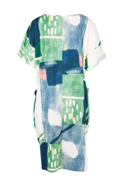 Product shot of the Pocket Print Dress in colour Multi (Green), from the back