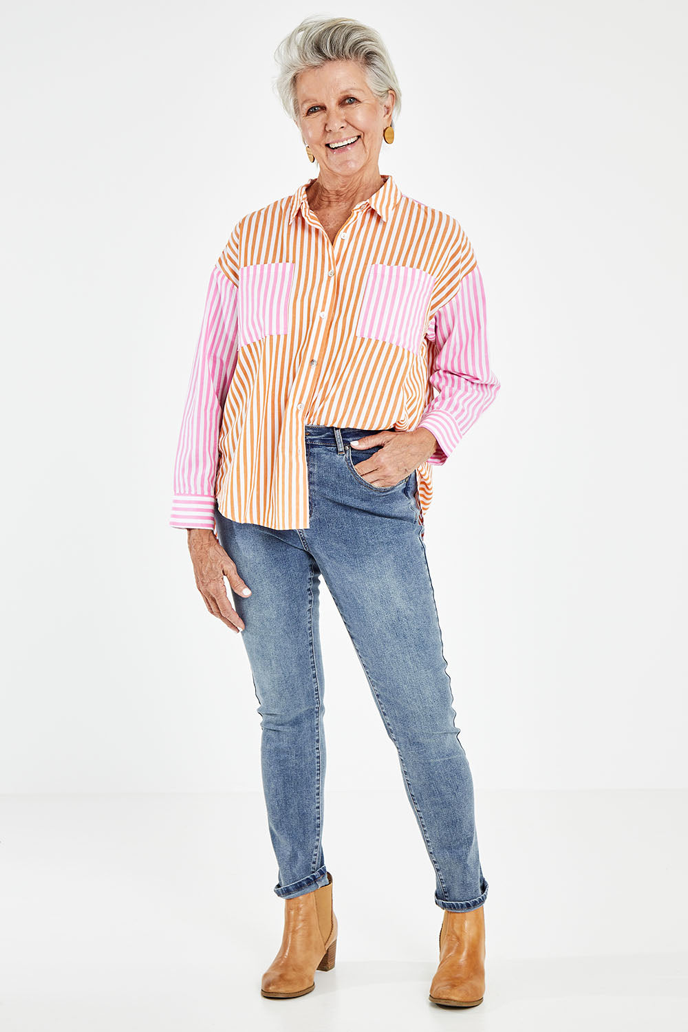 Model Elise wearing size S of the Stripe Shirt in colour Candy, from the front, showing the whole outfit