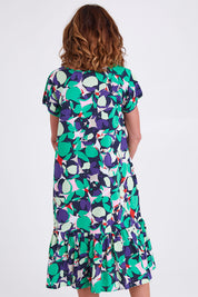 Model Emma wearing size S of the Edan Print Cotton Dress in colour Greenmulti (Green), from the back