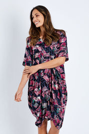 Model Amanda wearing size 10 of the Rayon Bounce Dress in colour Print (Pink), from the front, cropped image