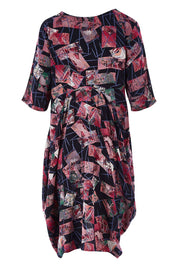 Product shot of the Rayon Bounce Dress in colour Print (Pink), from the back