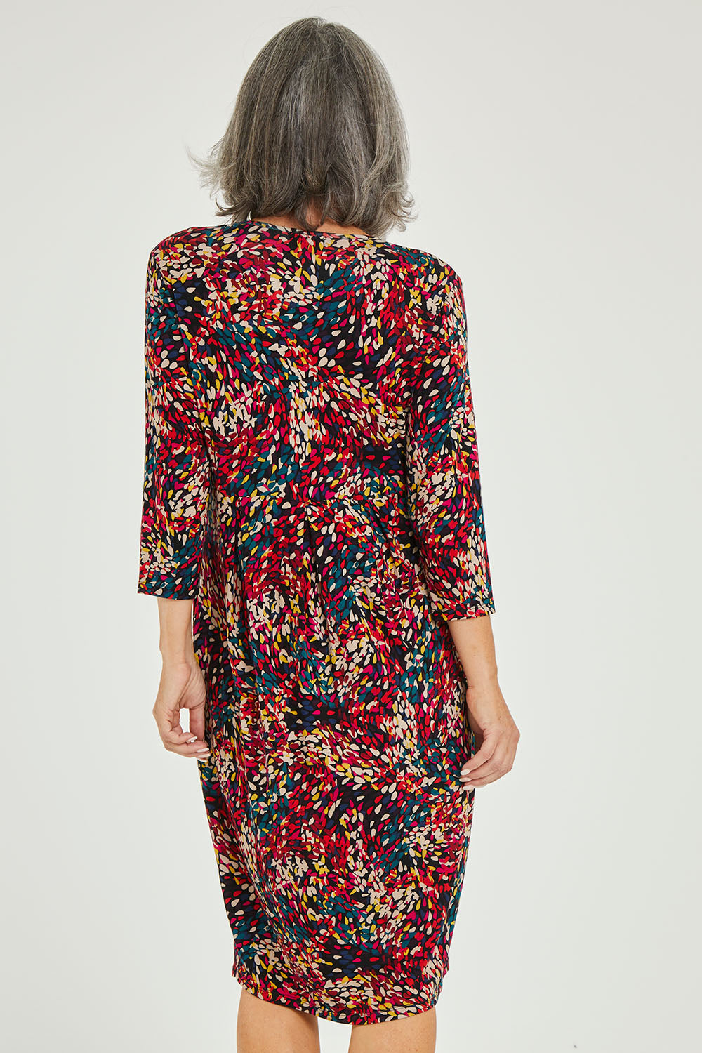 Model Luisa wearing size 10 of the Box Pleat Dress in colour Multiprint (Black), from the back