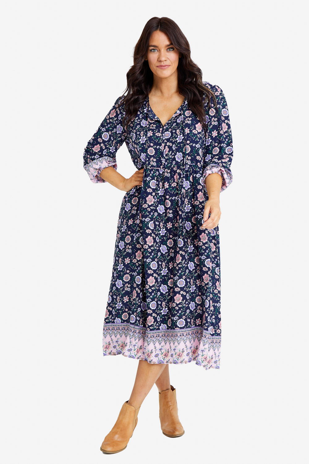 Model Laura wearing size 14 of the Boheme Long Sleeve Print Dress in colour Navy (Blue), from the front, showing the whole outfit