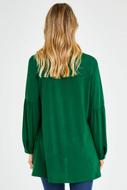 Model Kelly wearing size 10 of the Hi Lo Knit Tunic in colour Emerald (Green), from the back