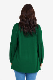 Model Laura wearing size 14 of the Preloved Hi Lo Knit Tunic in colour Emerald (Green), from the back