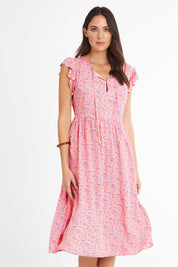 Model Madeline wearing size 10 of the Penny Dress in colour Pink (Pink), from the front, cropped image