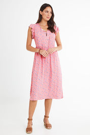 Model Madeline wearing size 10 of the Penny Dress in colour Pink (Pink), from the front, showing the whole outfit