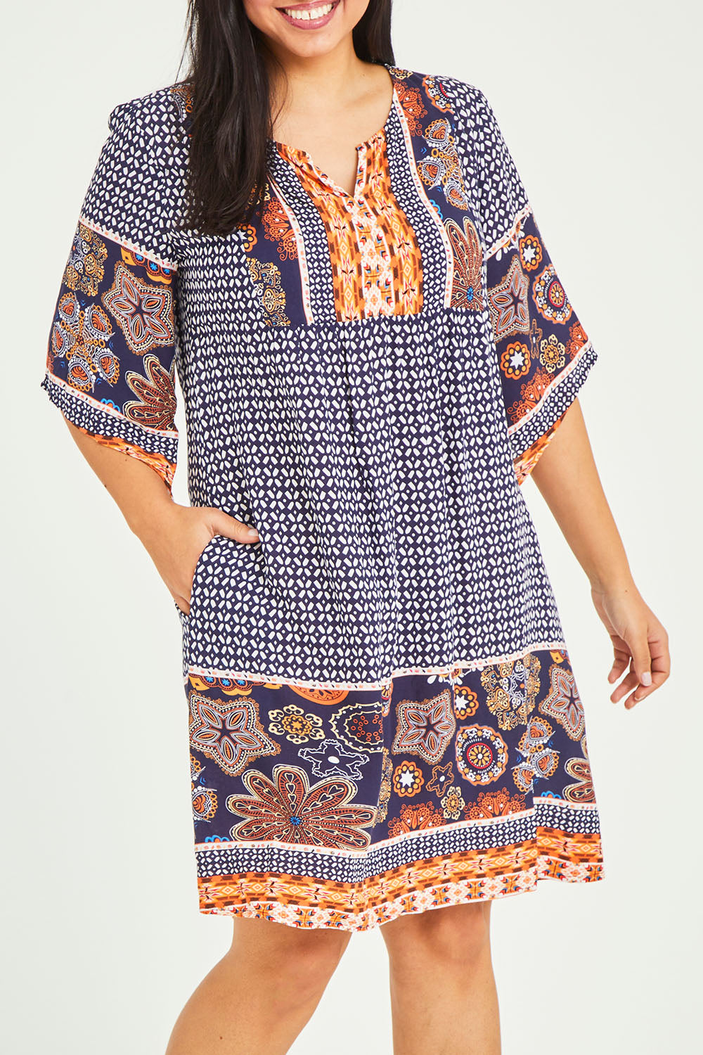 Model Terri-Leigh wearing size 14 of the Sun Dress in colour Navyprint (Blue), from the front, cropped image