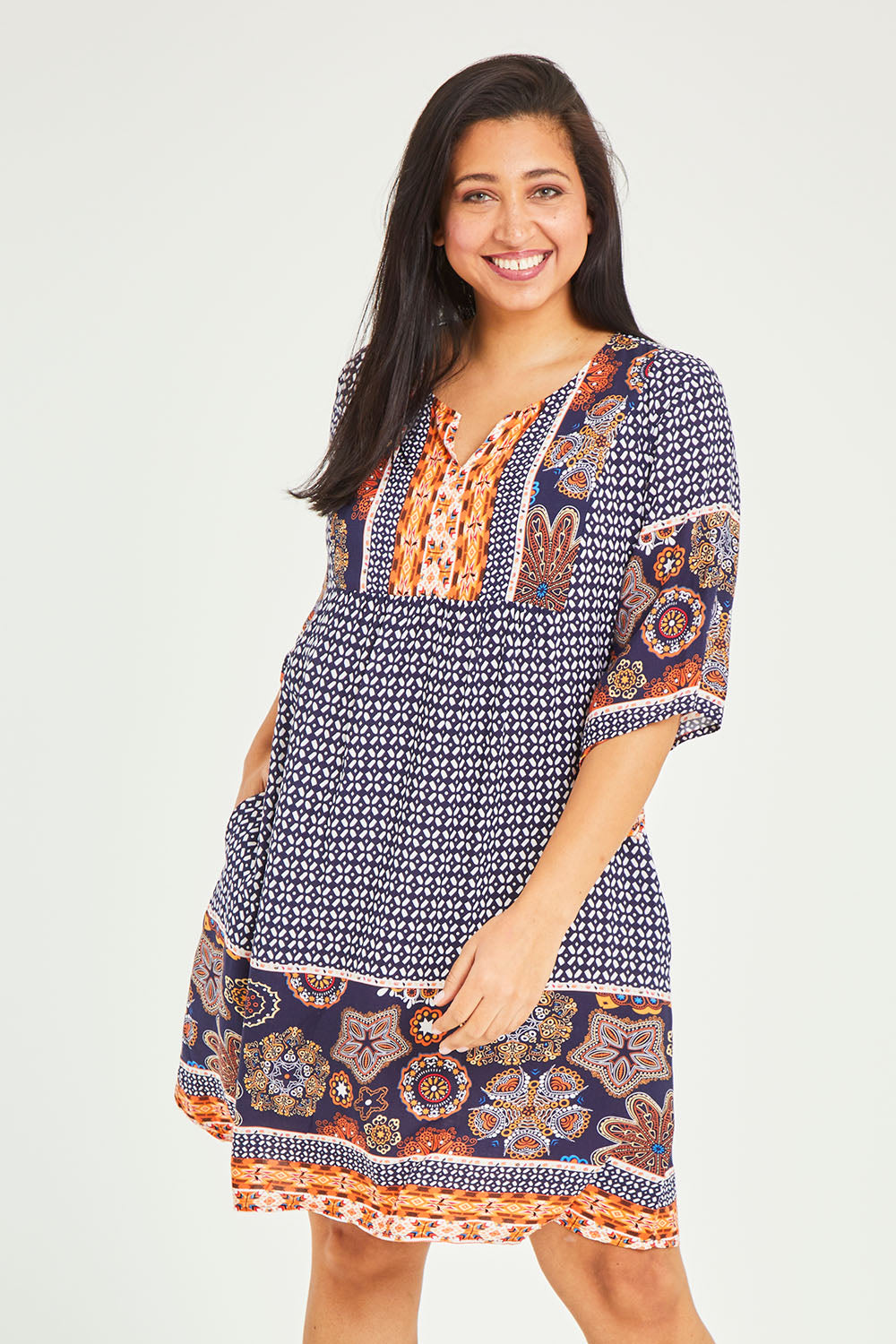 Model Terri-Leigh wearing size 14 of the Sun Dress in colour Navyprint (Blue), from the front, cropped image