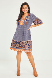 Model Terri-Leigh wearing size 14 of the Sun Dress in colour Navyprint (Blue), from the front, showing the whole outfit