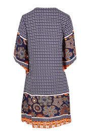 Product shot of the Sun Dress in colour Navyprint (Blue), from the back