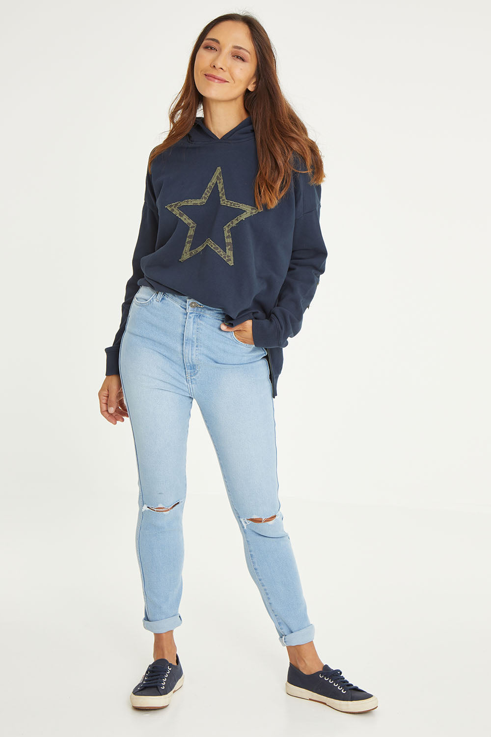 Model Cara wearing size 10 of the Hi Rider in colour Astral (Blue), from the front, showing the whole outfit