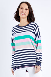 Model Andrea wearing size 10 of the Passion Stripe Knit in colour Stripe (White), from the front, cropped image
