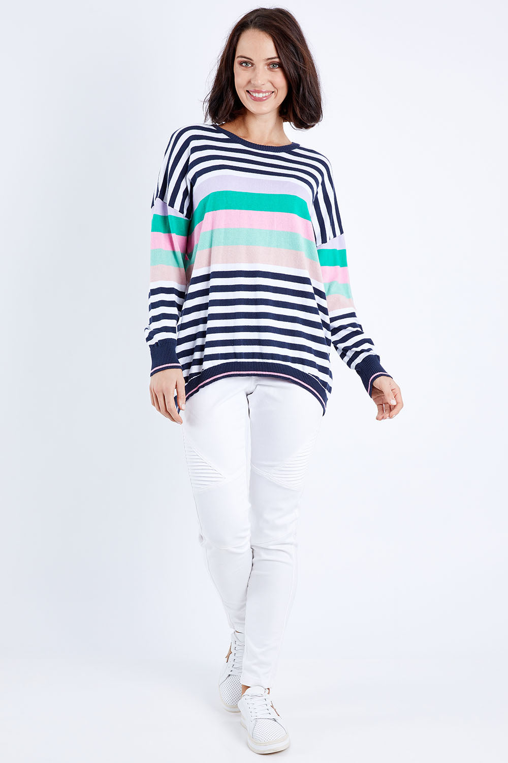 Model Andrea wearing size 10 of the Passion Stripe Knit in colour Stripe (White), from the front, showing the whole outfit