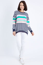Model Andrea wearing size 10 of the Passion Stripe Knit in colour Stripe (White), from the front, showing the whole outfit