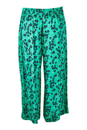 Product shot of the Eloise Floral Pant in colour Greenflora (Green), from the back