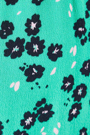 Product shot of the Eloise Floral Pant in colour Greenflora (Green), detail