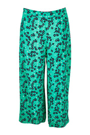 Product shot of the Eloise Floral Pant in colour Greenflora (Green), from the front