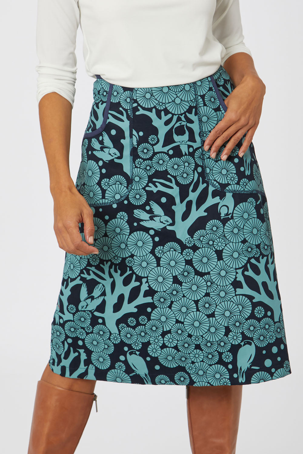 Model Cara wearing size S of the Avril Skirt Long Mikko in colour Greenink (Blue), from the front, cropped image