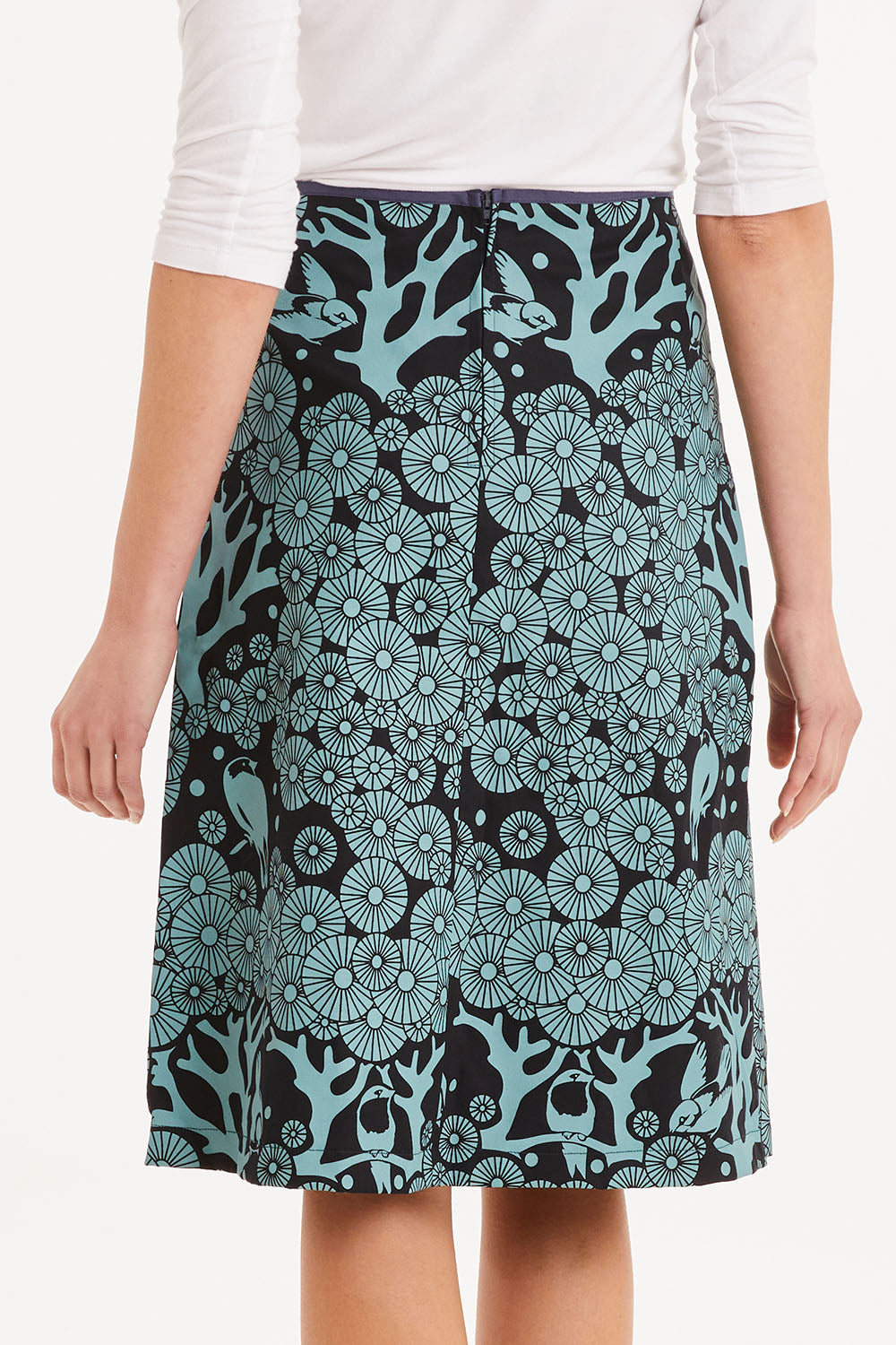 Model Madeline wearing size S of the Avril Skirt Long Mikko in colour Greenink (Blue), from the back