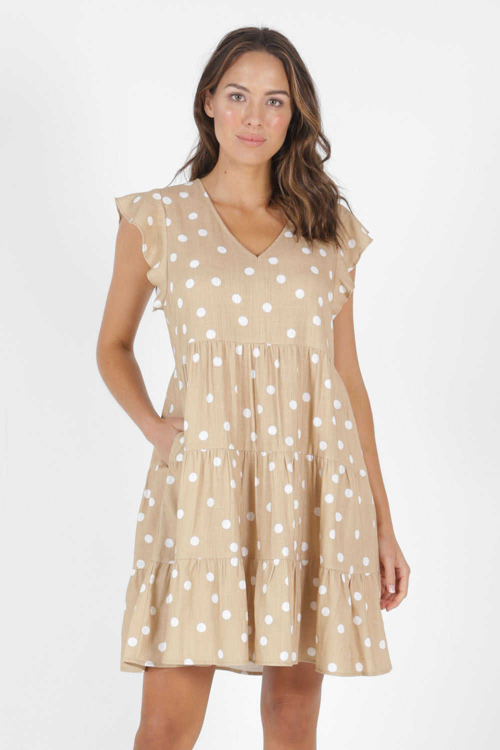 Model Madeline wearing size 10 of the Skyler Dress in colour Ecruspot, from the front, cropped image