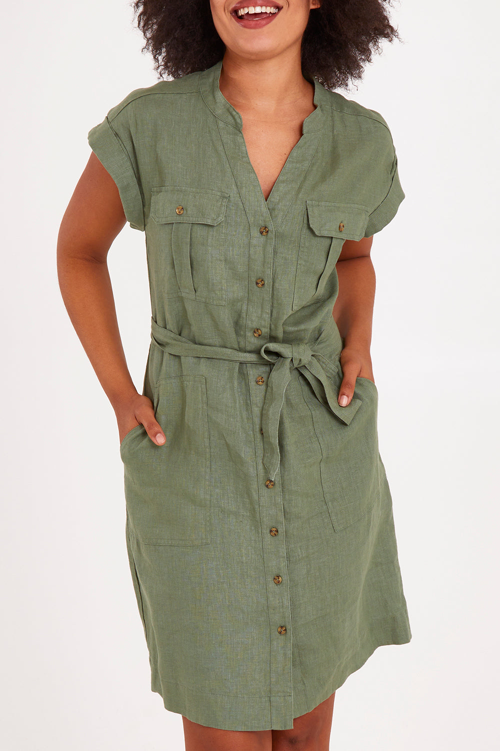Model Olivia wearing size 10 of the Harlow Dress in colour Khaki (Green), from the front, cropped image