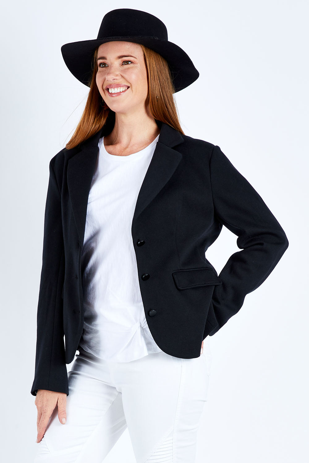 Model Katie wearing size 10 of the Elements Zinnia Blazer in colour Black (Black), from the front, cropped image