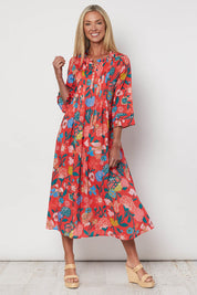 A model wearing the Floral Tuck Front Dress in colour Red (Red), from the front, showing the whole outfit