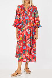 Model Rachel wearing size 10 of the Floral Tuck Front Dress in colour Red (Red), from the front, cropped image