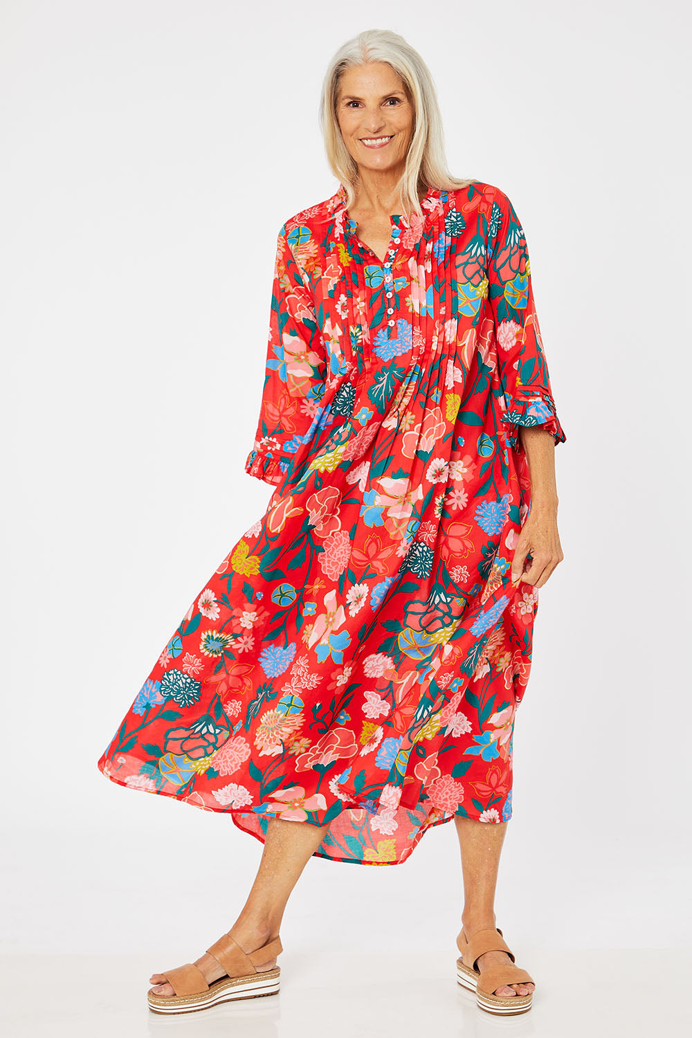 Model Rachel wearing the Floral Tuck Front Dress in colour Red (Red), from the front, showing the whole outfit