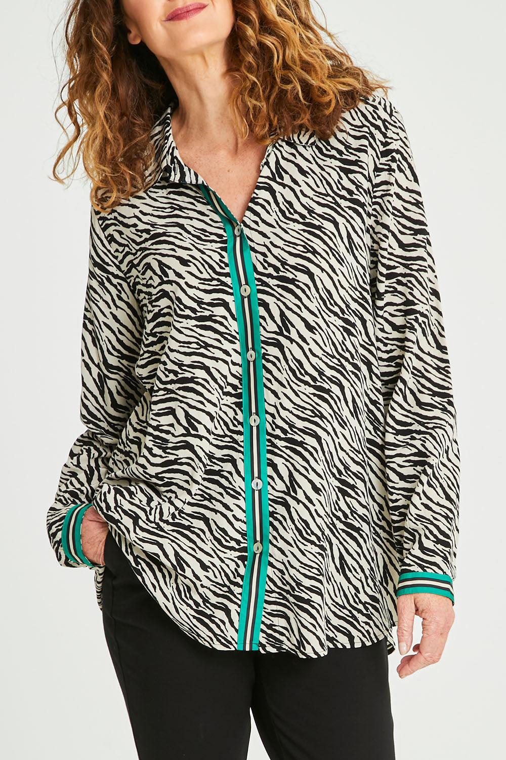 Model Emma wearing size 10 of the Animal Shirt With Green Trim in colour Emerald (Green), from the front, cropped image
