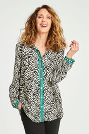 Model Emma wearing size 10 of the Animal Shirt With Green Trim in colour Emerald (Green), from the front, cropped image