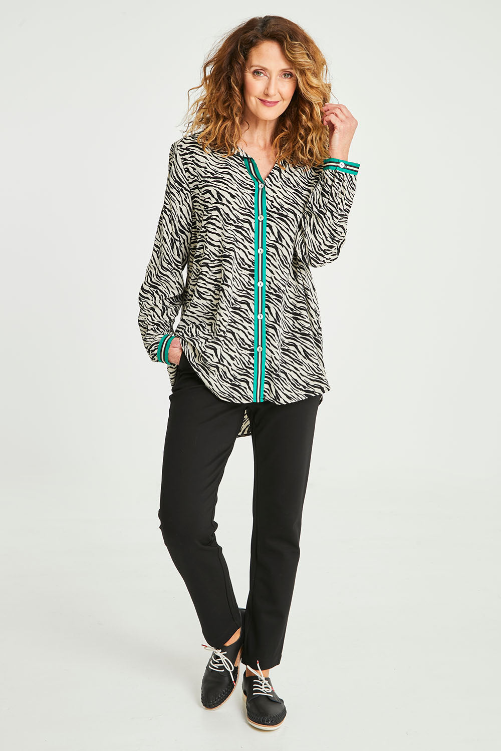 Model Emma wearing size 10 of the Animal Shirt With Green Trim in colour Emerald (Green), from the front, showing the whole outfit