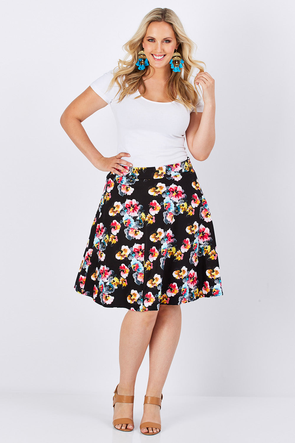 Model Jess wearing size 14 of the Printed Swing Skirt in colour Comical (Black), from the front, showing the whole outfit