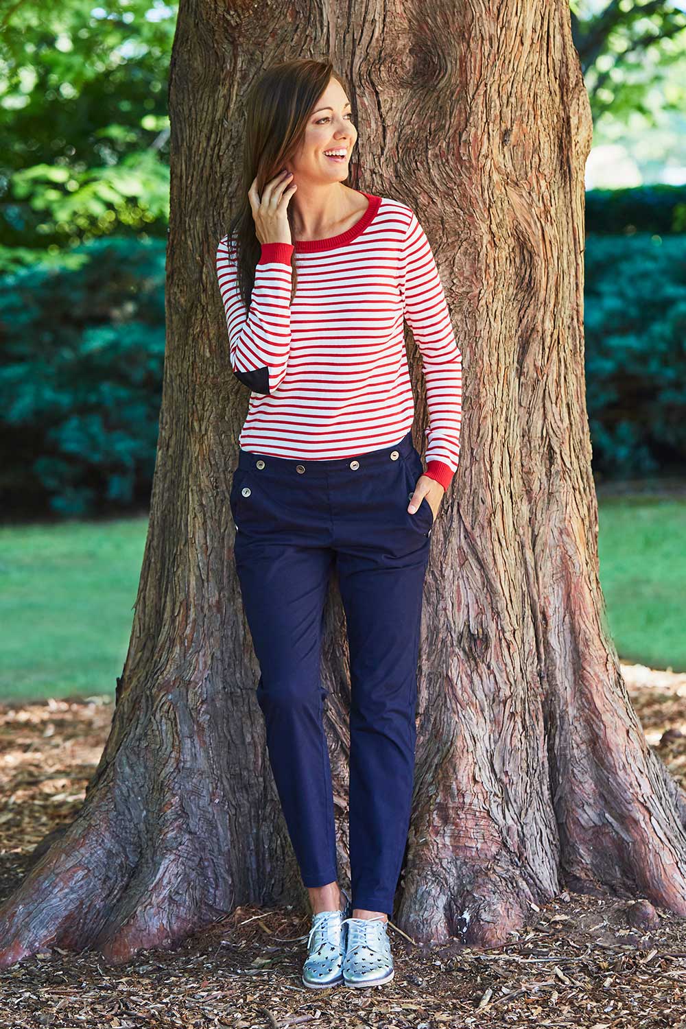 Model Lara wearing size 10 of the Sailor Pants in colour Sailor (Black), from the front, showing the whole outfit