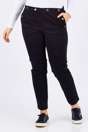 Model Tia wearing size 14 of the Sailor Pants in colour Sailor (Black), from the front, cropped image
