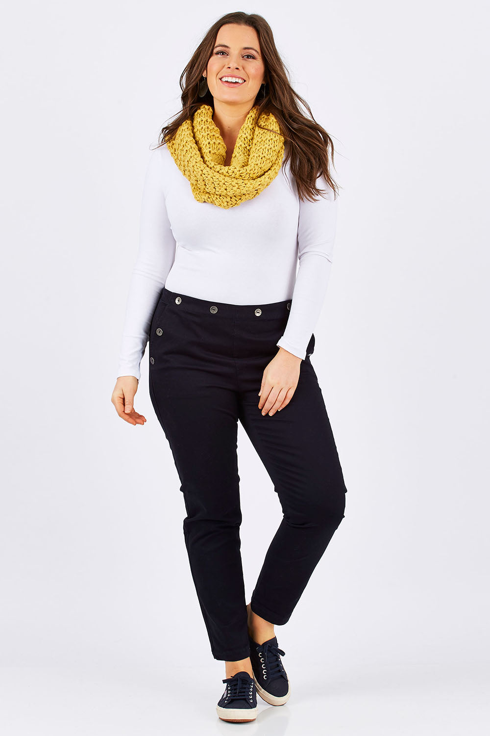 Model Tia wearing size 14 of the Sailor Pants in colour Sailor (Black), from the front, showing the whole outfit