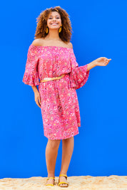 Model Summer wearing size 10 of the Off Shoulder Floral Dress in colour Persimmon (Pink), from the front, showing the whole outfit