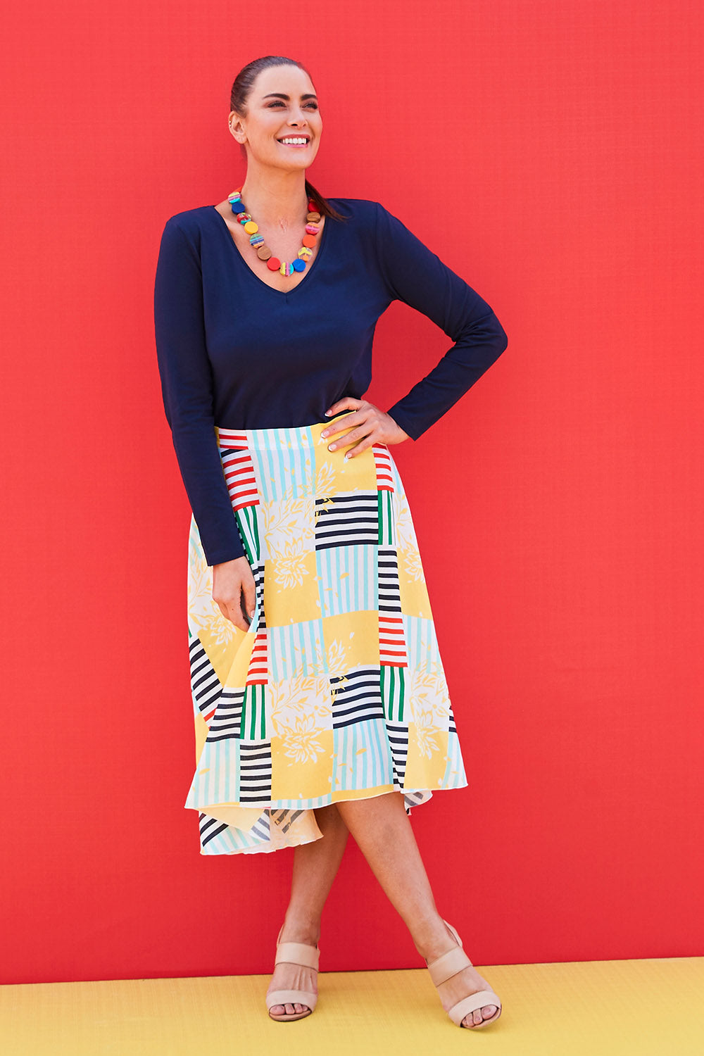Model Abby wearing size 14 of the Tie Waist Skirt in colour Patched (White), from the front, showing the whole outfit