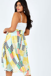 Model Shanaya wearing size 14 of the Tie Waist Skirt in colour Patched (White), from the front, cropped image